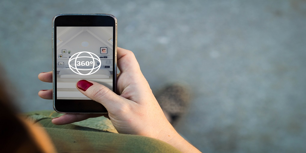 Woman surfing a 360 degree view in her smartphone 